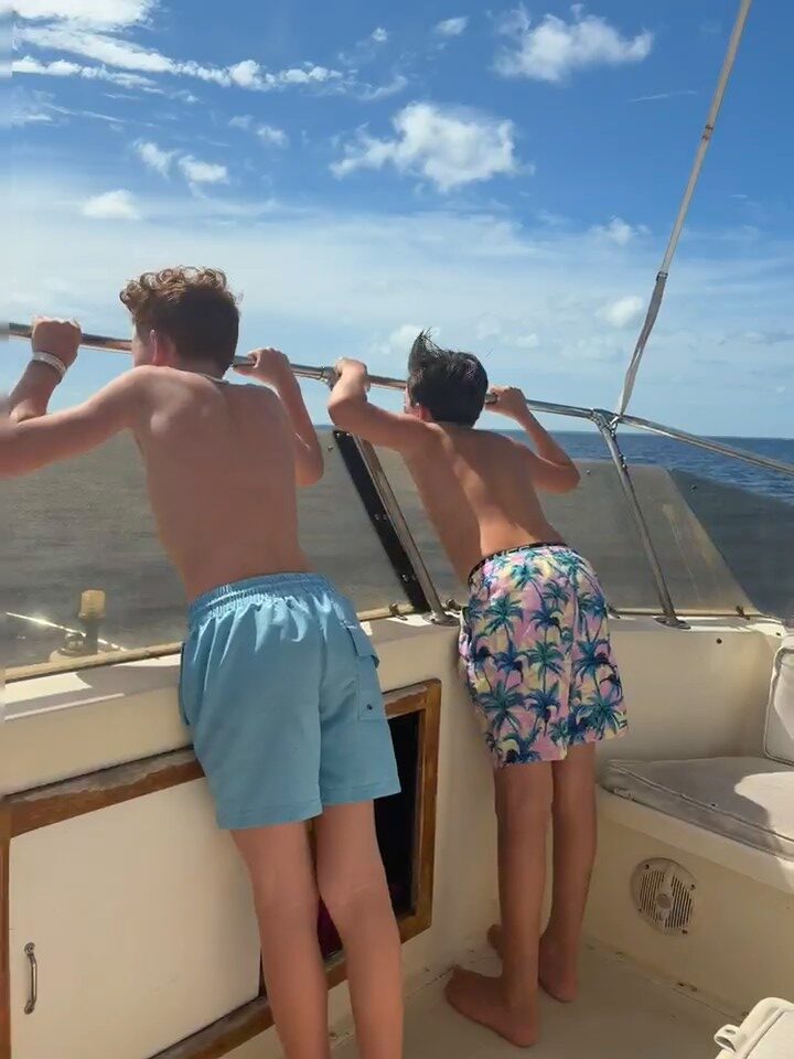 Young guests looking across the water during their Mutton Fish Tours excursion